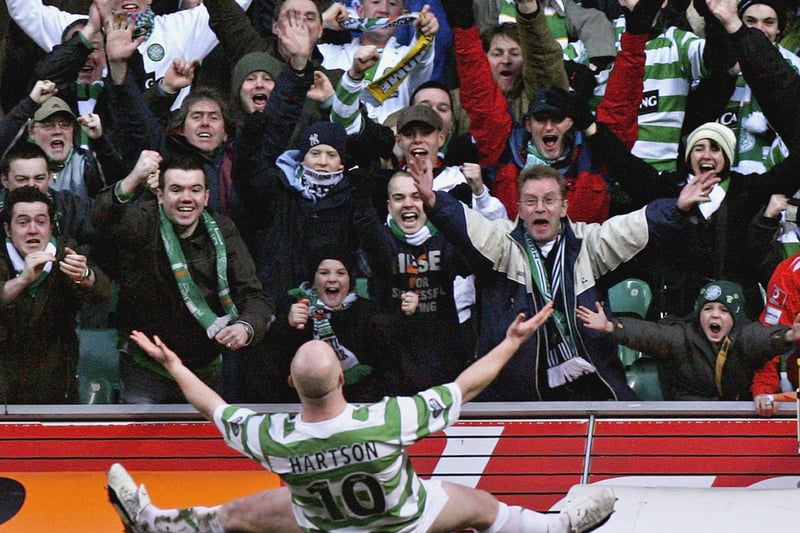 John Hartson celebrates with fans after putting his side ahead in the game that would clinch the first title under Gordon Strachan. 