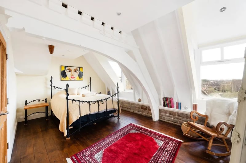 The bedrooms are light and bright, with wooden floors and a vaulted ceiling rising up within the roof pitch. 