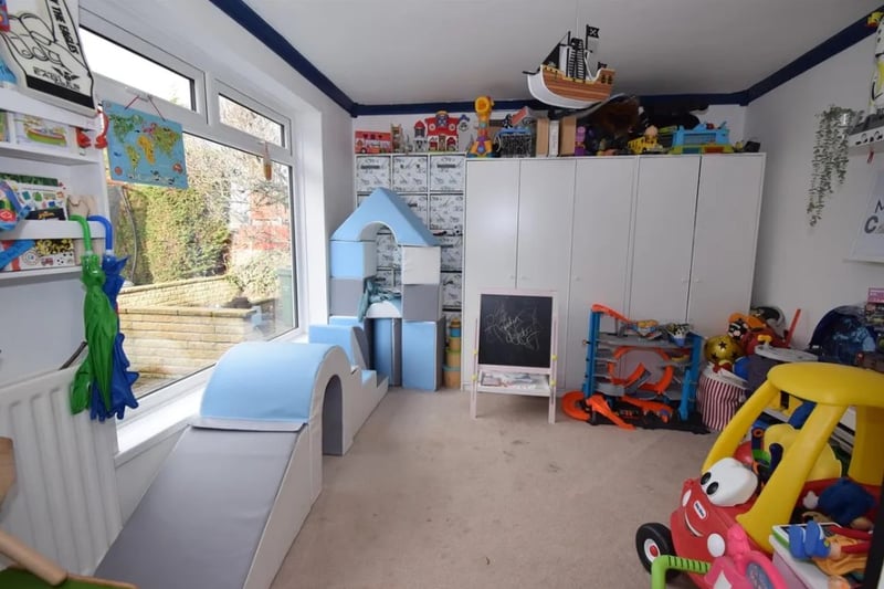 The property has a large room being used as a playroom downstairs