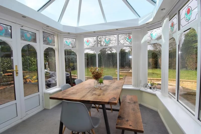 The large conservatory is currently being used as a dining room