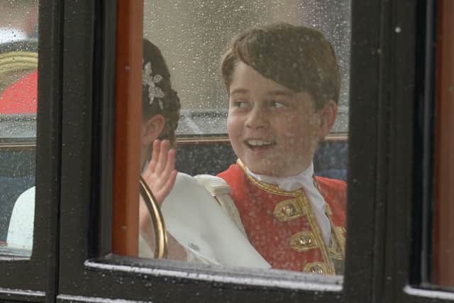 Prince George returns to Buckingham Palace by coach following the coronation ceremony of King Charles III and Queen Camilla