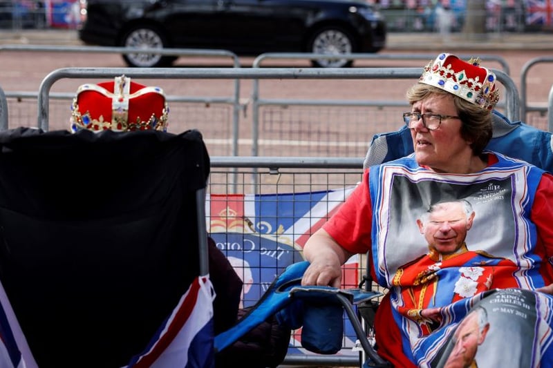 Royal fans camping out along the procession route. (Photo by ODD ANDERSEN/AFP via Getty Images)