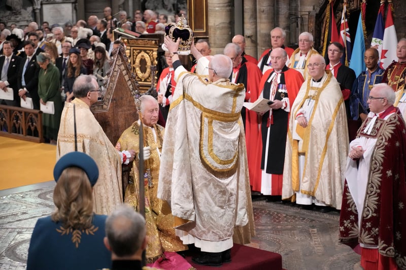 King Charles III was crowned following his anointment by the Archbishop of Canterbury. St Edward's Crown was placed on top of his head as he held the royal Sceptre and the Jewelled Sword of Offering. (Credit: PA)