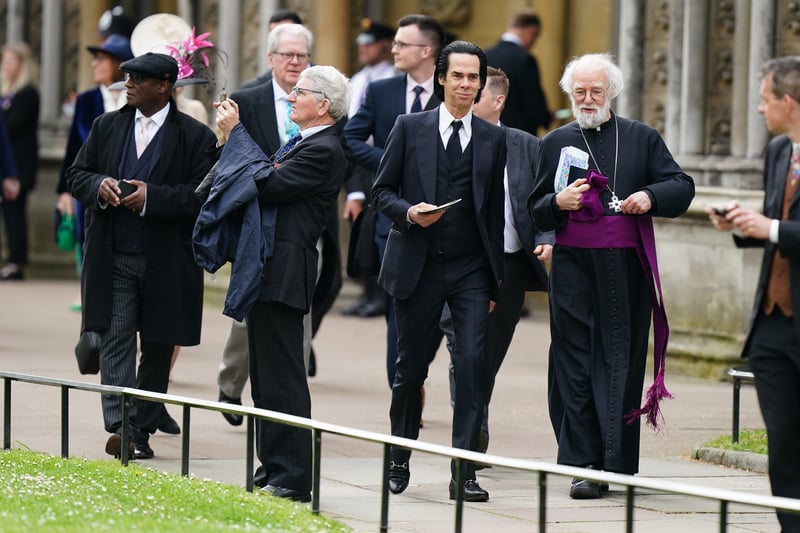 Nick Cave and Rowan Williams, the former Archbishop of Canterbury. The Australian singer said this week he is neither a monarchist nor an ardent republican, but that he could not turn down an invitation to an important moment in UK history: “Not just the most important, but the strangest, the weirdest.”  (Photo by Jane Barlow - WPA Pool/Getty Images)