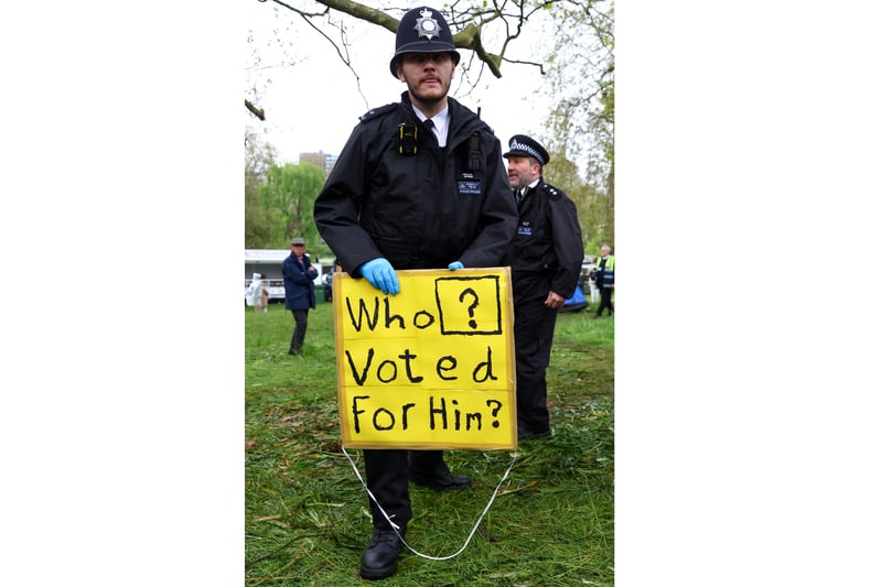 A protester’s cunning loophole to get around the draconian new laws. (Photo by PAUL CHILDS/POOL/AFP via Getty Images)