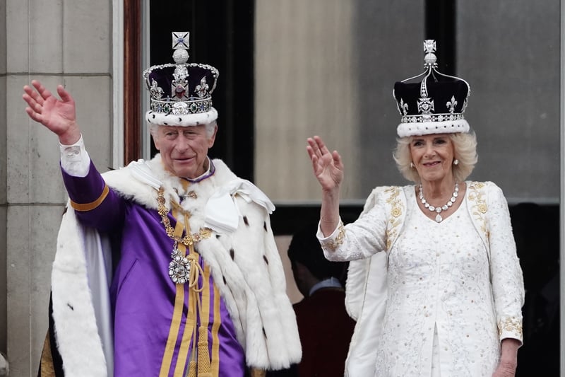 Following the procession through London, the King and Queen greeted crowds on the royal balcony at Buckingham Palace. They were joined by members of the royal family ahead of the Red Arrows flyover. (Credit: PA)