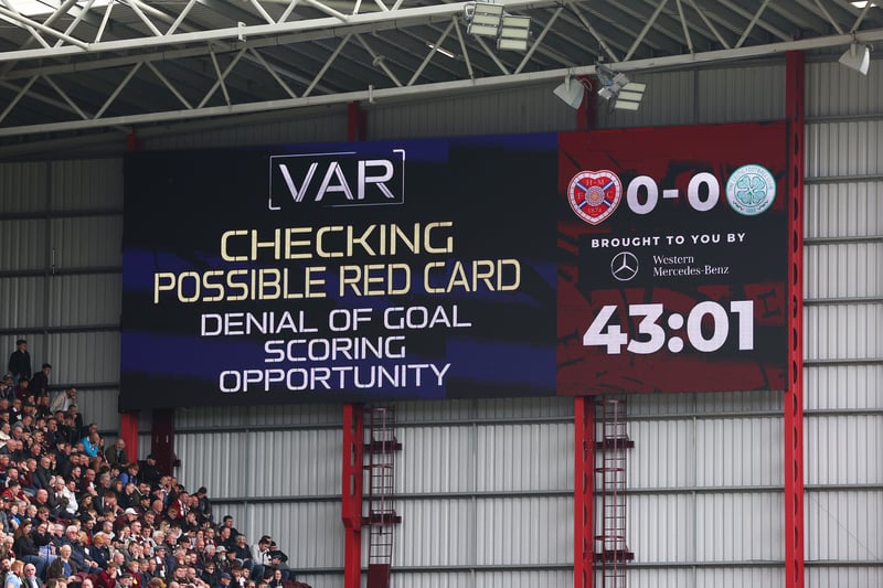 The LED board shows VAR is checking a possible red card for “denial of goal scoring opportunity” 