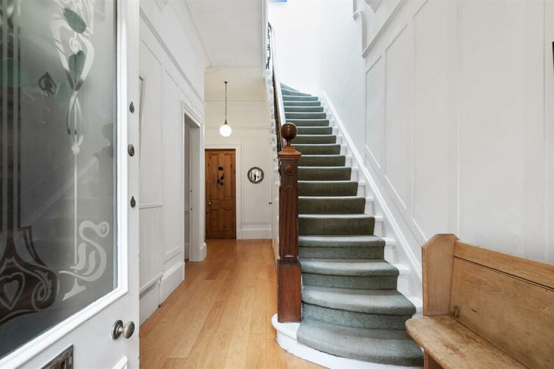 Inside, the stairway is original with a large reception hallway. 
