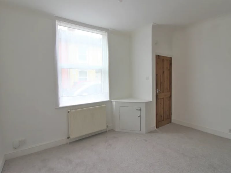 The front door leads to the living area