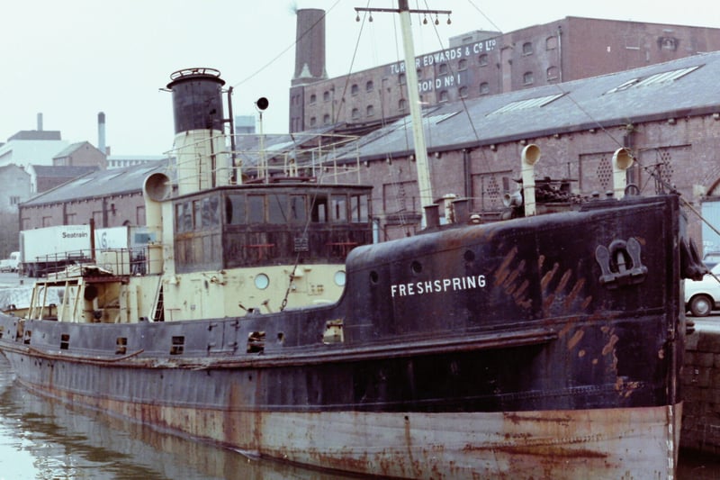 The SS Freshspring moored in the floating harbour in 1979, alongside old warehouses.