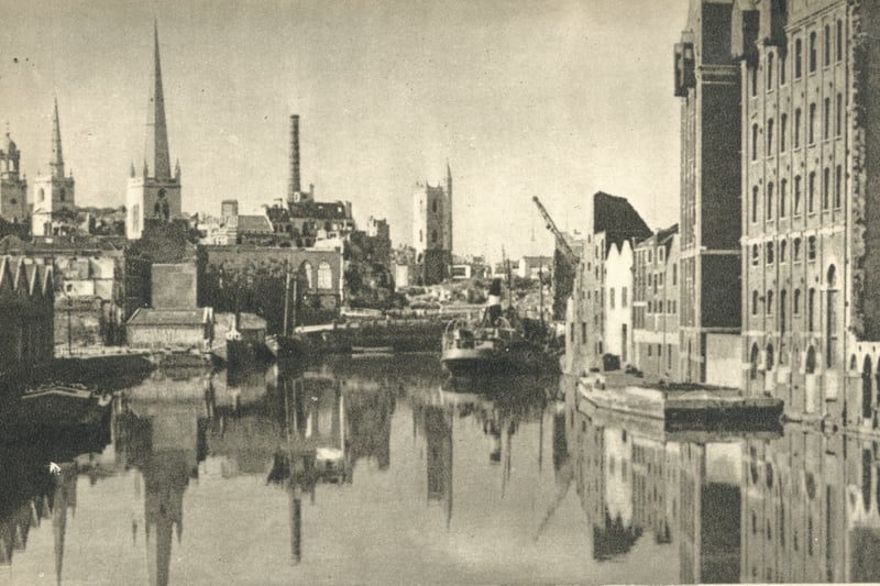 A post-war postcard looking north up the floating harbour towards Bristol Bridge from Redcliffe Bridge. It shows the devastation wrought upon the city during the Blitz, although the city’s church towers still stand proud.