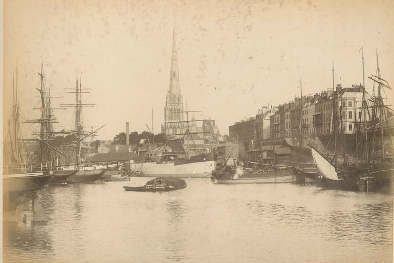 Busy view of the floating harbour looking east from Prince Street bridge and towards St Mary Redcliffe Church, circa 1890.