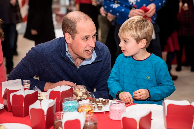 Prince William is pictured here with five-year-old Harry O’Grady, as they make chocolate truffles at a Christmas party at Kensington Palace. If you can’t get royalty on the case, you could spend £100 on a 100-piece Harrods mixed chocolate box, or you could just get a Twirl or a (somehow still more luxurious) Galaxy. (Photo credit should read RICHARD POHLE/AFP via Getty Images)