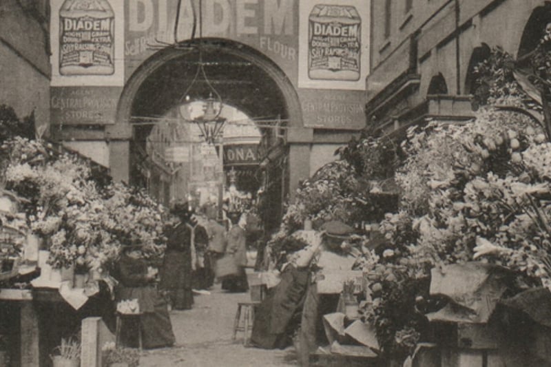 This amazing photo from 1910 shows a huge flower stall in the Glass Arcade at the entrance onto High Street. Photo: Bristol Archives