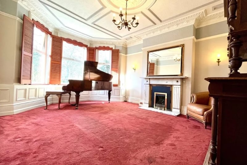 The main living room is a good size with orginal period features including a nice fireplace