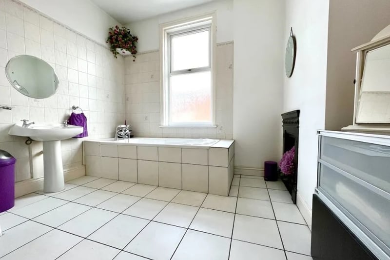 The main family bathroom has a large space and walk-in shower
