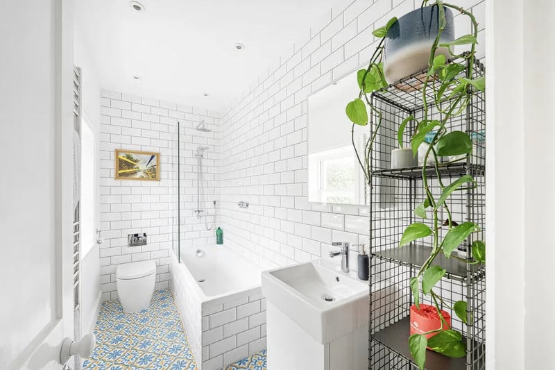 “These bedrooms share a stylish family bathroom with decorative floor tiling, contemporary metro tiling to the walls, a panelled bath with a thermostatic shower above, w.c and wash basin as well as a working sash window and heated towel ladder.”