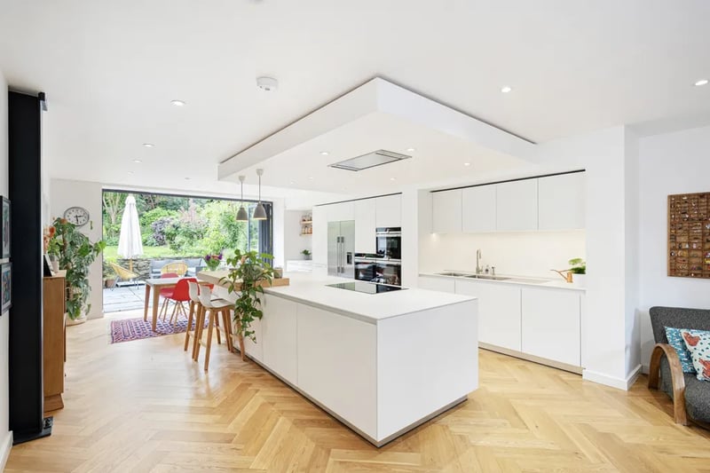 “The kitchen is custom designed and finished to the very highest standard, complete with an oversize central island and state of the art fixtures and fittings.”