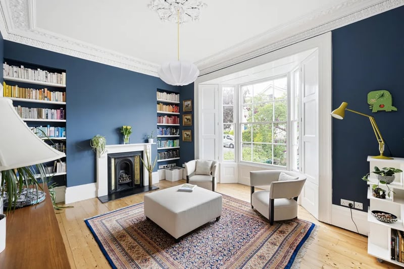 “Across the hall floor lie two beautifully reception rooms, sensitively blending the retained period features of the property with its distinctive contemporary finish.”