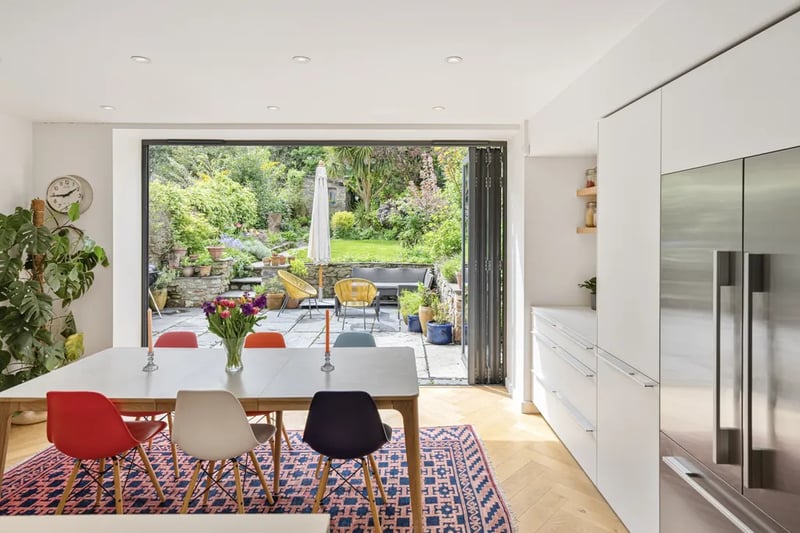 “Across the lower ground floor runs a sensational 36’ family kitchen, dining room and snug, with natural light flooding in via full-width bi-folding doors opening into the garden.”
