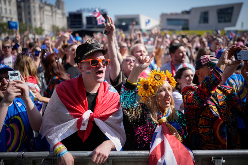 Eurovision fans enjoy the party atmosphere as they gather in Liverpool. Image: Christopher Furlong/Getty Images