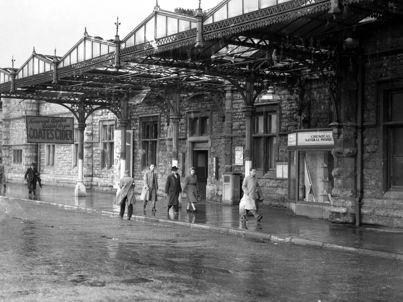 It appears to be a wet day as people walk toward the main entrance at Bristol Temple Meads in this scene from the 1960s