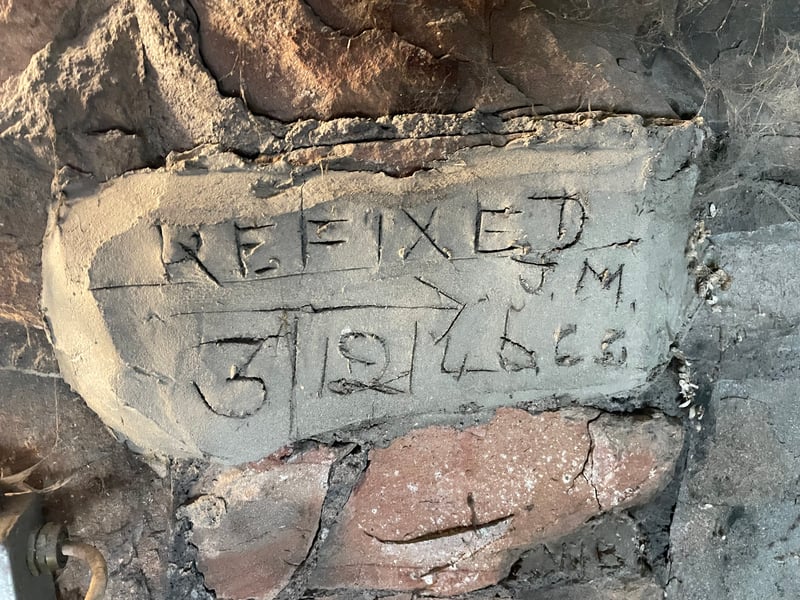 During the Bristol Blitz, Temple Meads station was bombed and the clock tower above the ticket office was destroyed. In 1946, it was repaired as this graffiti on the cement inside the clock chamber shows.