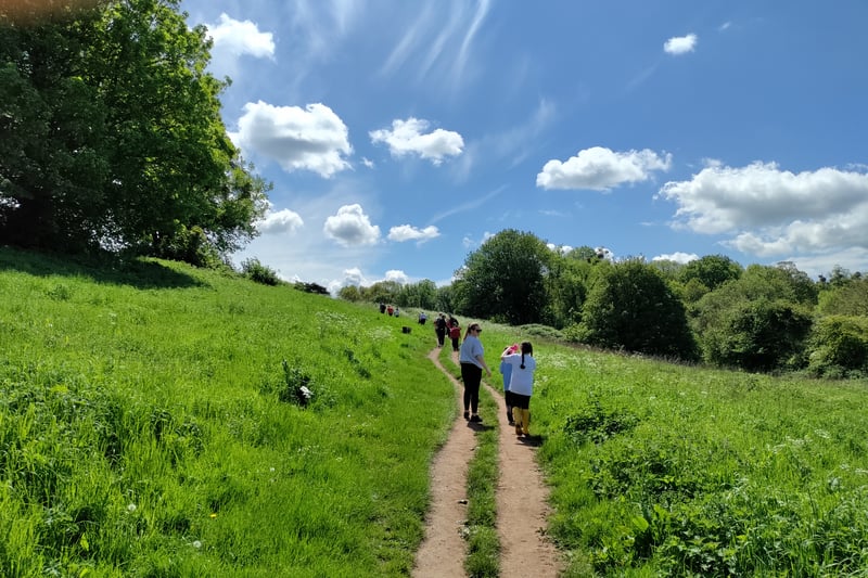 The sun is out and the well-trodden footpath from woodland off Kings Weston Lane to the front garden of Kings Weston House is busy with school children on an outing.