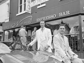Maurizio Mori (foreground, sitting on car) and Gian Bohen (behind the car) celebrate the launch of Nonnas in this rare photo. 