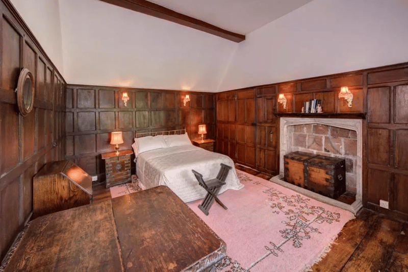 Another bedroom inside the property; the architecture represents two distinct periods, with the oldest section believed to date back to 1605, while the attractive Georgian frontage was added towards the end of the 18th century (Credit: Knight Frank)