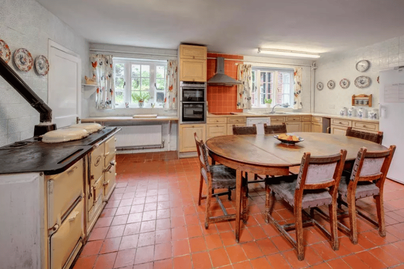 The traditional kitchen in Brightwell Manor, including the old aga to book with (Credit: Knight Frank)