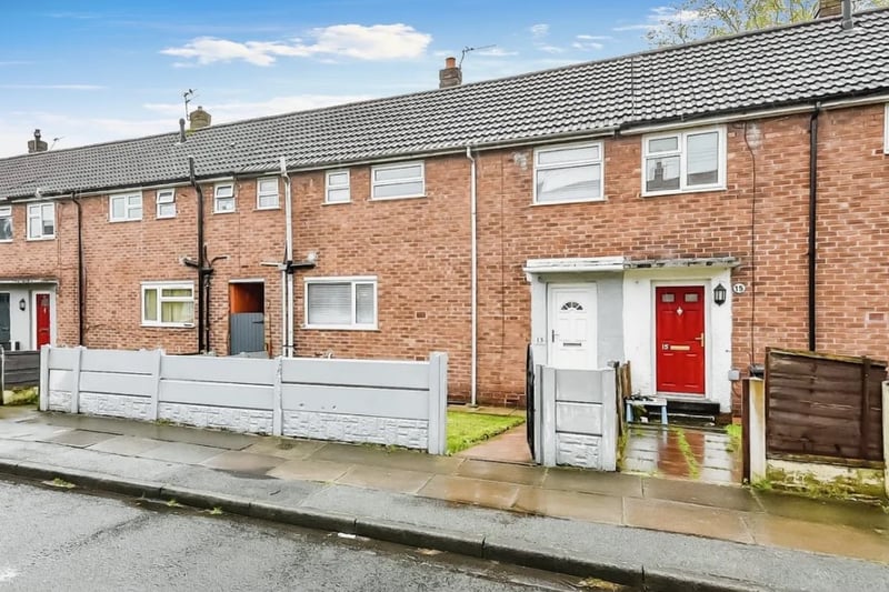 The property is a terraced home and features a small front garden