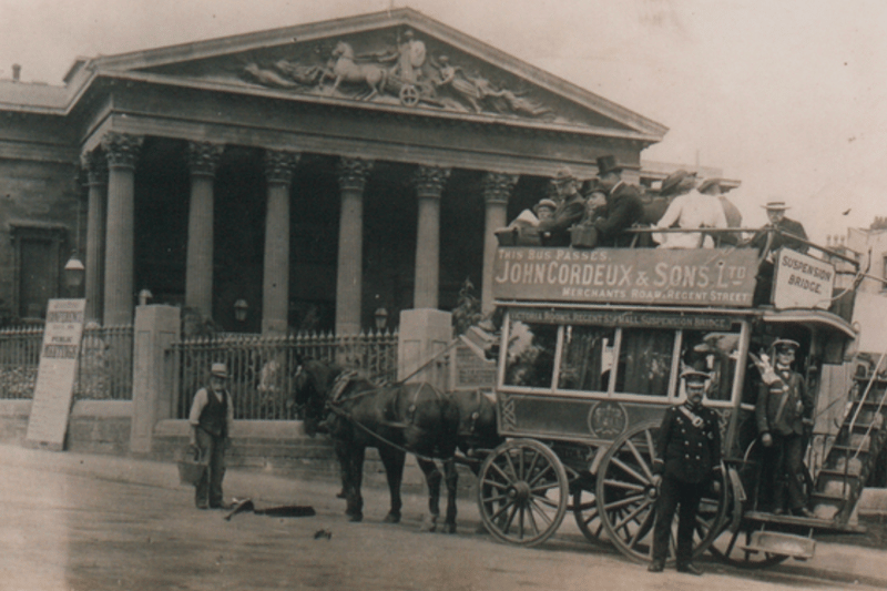 A horse-drawn bus outside the Victoria Rooms in 1900