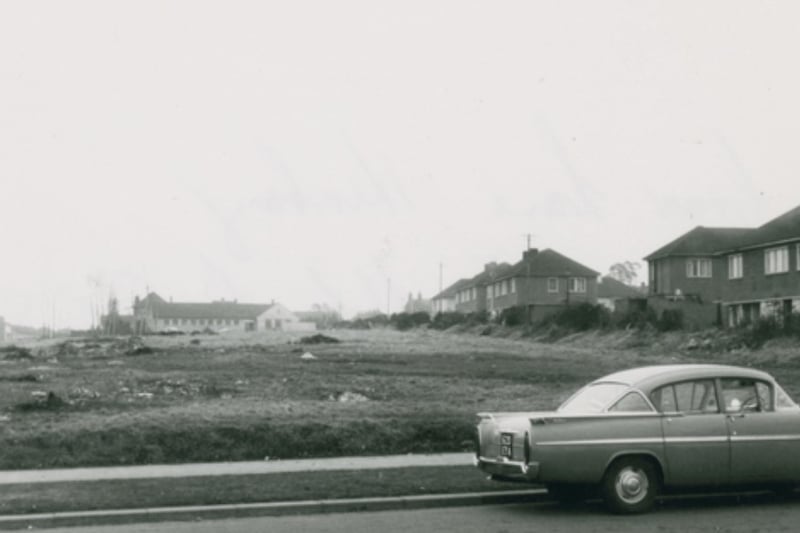 A car parked opposite the shops on Crow Lane in the 1960s - do you recognise the car?