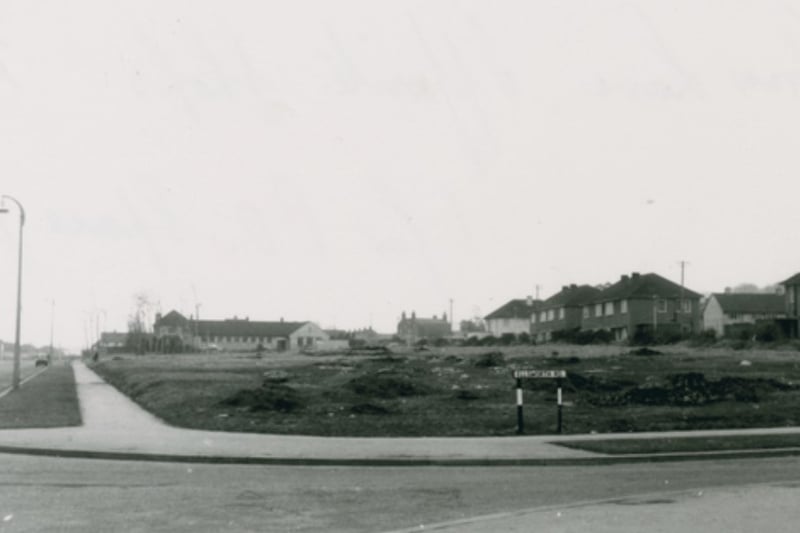 The area opposite the shops on Crow Lane was mainly grassland in this 1960s shot.