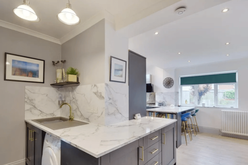 The kitchen features stunning marble worktops