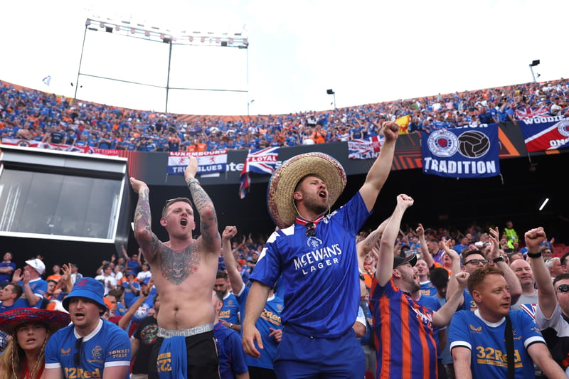 Supporters show their support during the match, with one individual sporting a sombrero 