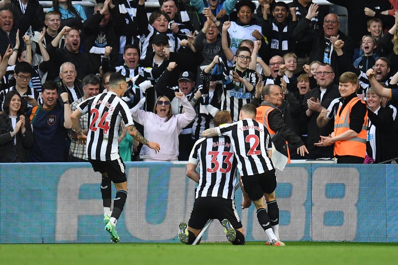 Newcastle United's English defender Dan Burn (C) celebrates with teammates after scoring his team second goal during the English Premier League football match between Newcastle United and Brighton and Hove Albion at St James' Park in Newcastle-upon-Tyne, north east England on May 18, 2023. (Photo by Oli SCARFF / AFP) / RESTRICTED TO EDITORIAL USE. No use with unauthorized audio, video, data, fixture lists, club/league logos or 'live' services. Online in-match use limited to 120 images. An additional 40 images may be used in extra time. No video emulation. Social media in-match use limited to 120 images. An additional 40 images may be used in extra time. No use in betting publications, games or single club/league/player publications. /  (Photo by OLI SCARFF/AFP via Getty Images)