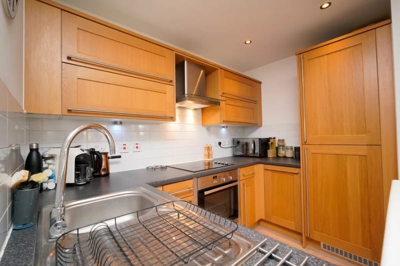 The kitchen is small but being open plan with the living room makes it feel a lot more spacious