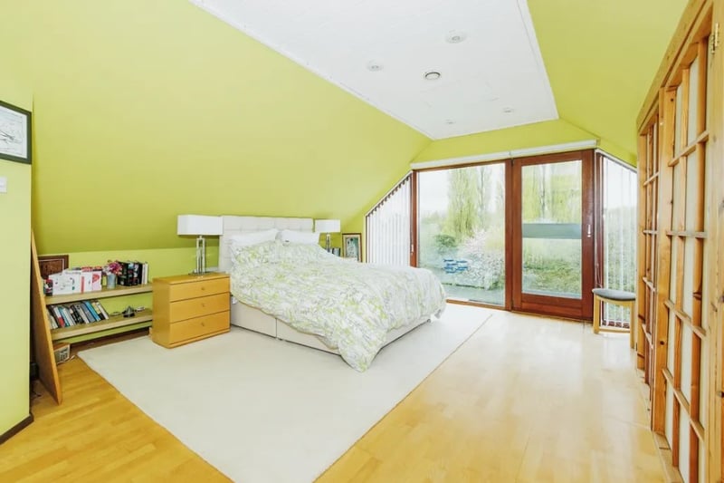 The main bedroom is incredibly spacious and has large windows that let in lots of sun light