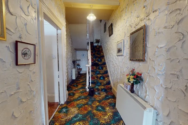 The entrance hallway is spacious but needs so modernising 