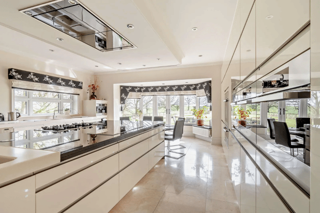 The modern kitchen has a sleek and seamless design