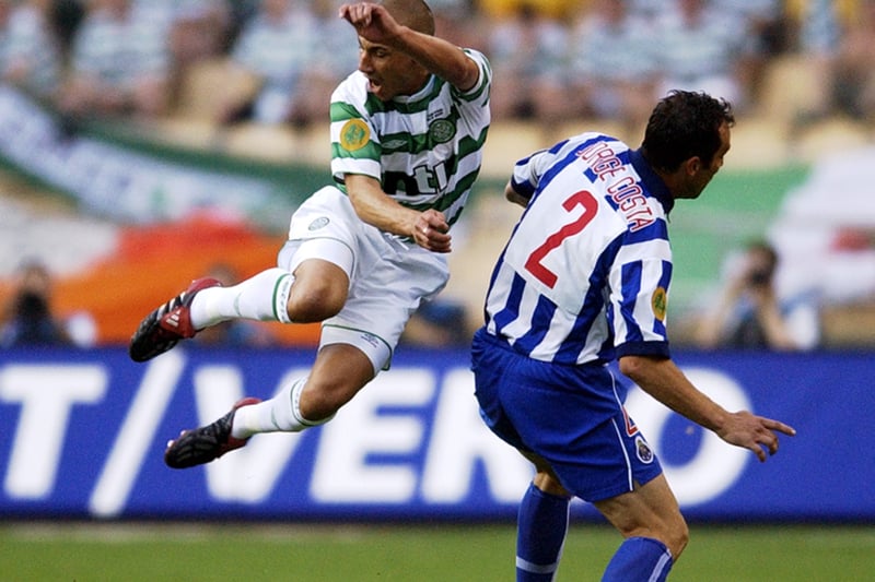 Striker Henrik Larsson is sent flying up in the air by the challenge from Porto defender Jorge Costa.