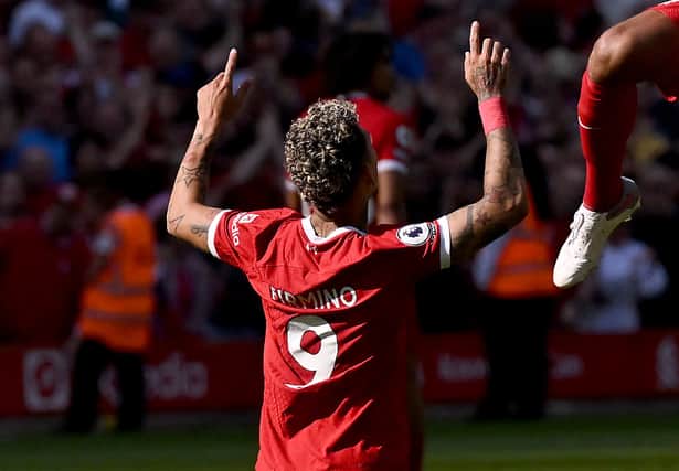 Roberto Firmino of Liverpool celebrates after scoring the equalising goal during the Premier League match between Liverpool FC and Aston Villa at Anfield on May 20, 2023 in Liverpool, England. (Photo by Andrew Powell/Liverpool FC via Getty Images)