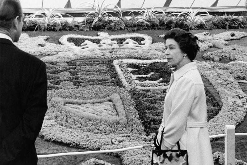 The Queen and Prince Philip viewing the carpet bedding of the Royal Coat of Arms.  (Photo by Fox Photos/Hulton Archive/Getty Images)