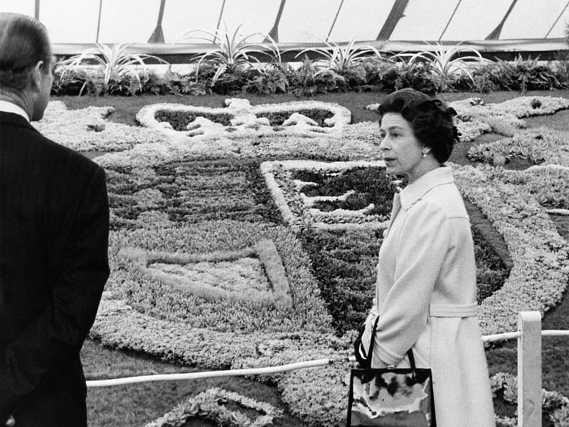 The Queen and Prince Philip viewing the carpet bedding of the Royal Coat of Arms. (Photo by Fox Photos/Hulton Archive/Getty Images)