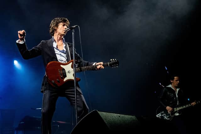 Alex Turner (L) of the Arctic Monkeys performs during a concert in the Ziggo Dome, Amsterdam, on May 5, 2023.