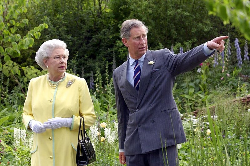 The Queen and the then Prince of Wales at the Healing Garden, which was designed by the Prince in conjunction with designer Jinny Blom to honour the late Queen Elizabeth The Queen Mother. (Photo by FIONA HANSON/AFP via Getty Images)