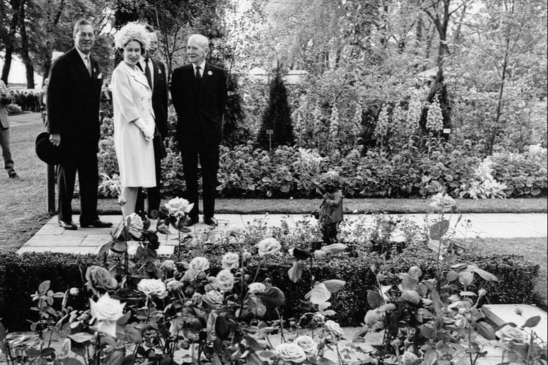 The Queen viewing a rose bed, exhibited by Popular Gardening magazine. (Photo by George Freston/Fox Photos/Hulton Archive/Getty Images)
