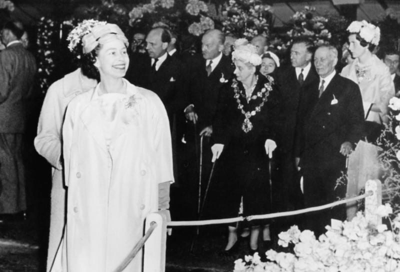 Queen Elizabeth II touring the show. (Photo by Central Press/Hulton Archive/Getty Images)